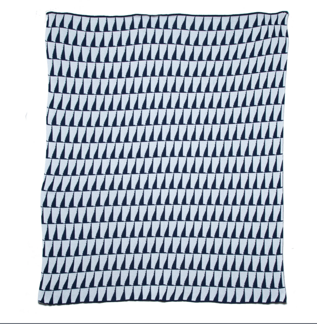 Eco-friendly outdoor throw blanket by In2Green, featuring natural fibers and vibrant colors for home outdoor decor.