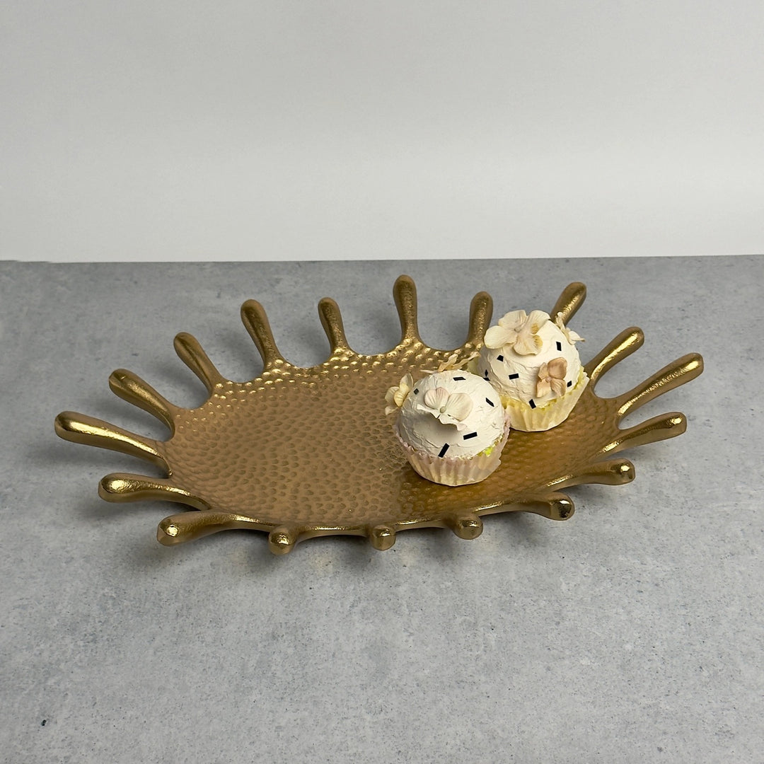 Gold oval splash dish from India Handicrafts, decorative home accent with a shiny, textured surface for elegant table display.