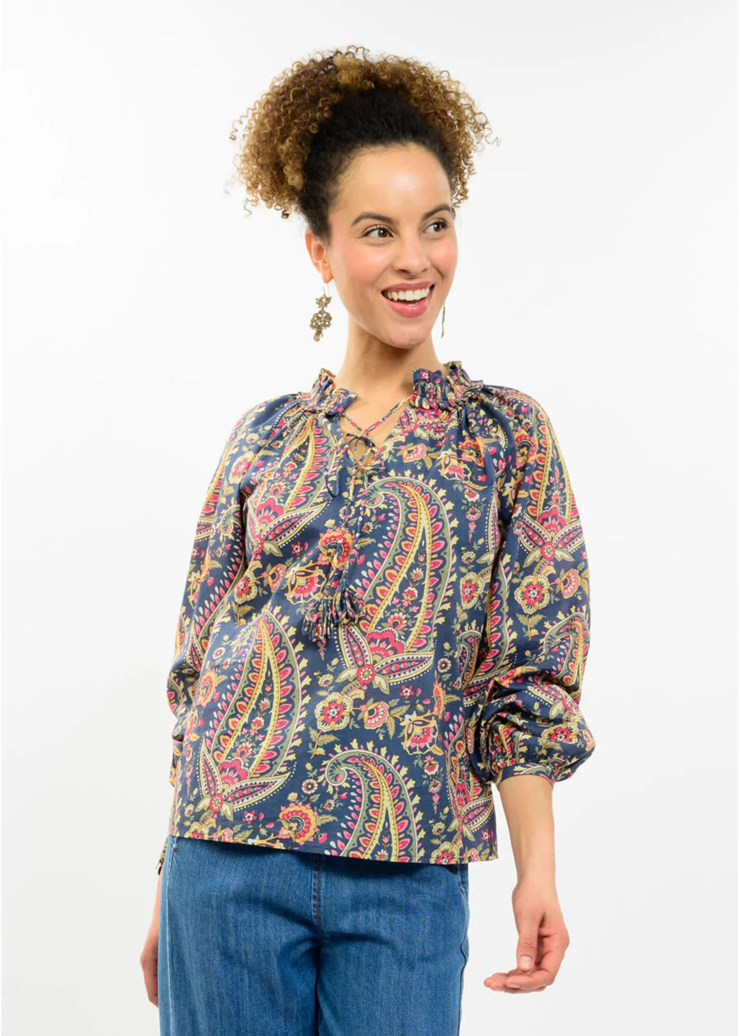 Blue paisley tassel top from Sister Mary featuring floral print and loop detailing, styled as a trendy women's blouse.