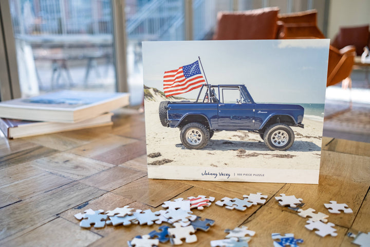 American Bronco 500-piece puzzle by Johnny Vacay featuring a colorful image of a classic American bronco horse.
