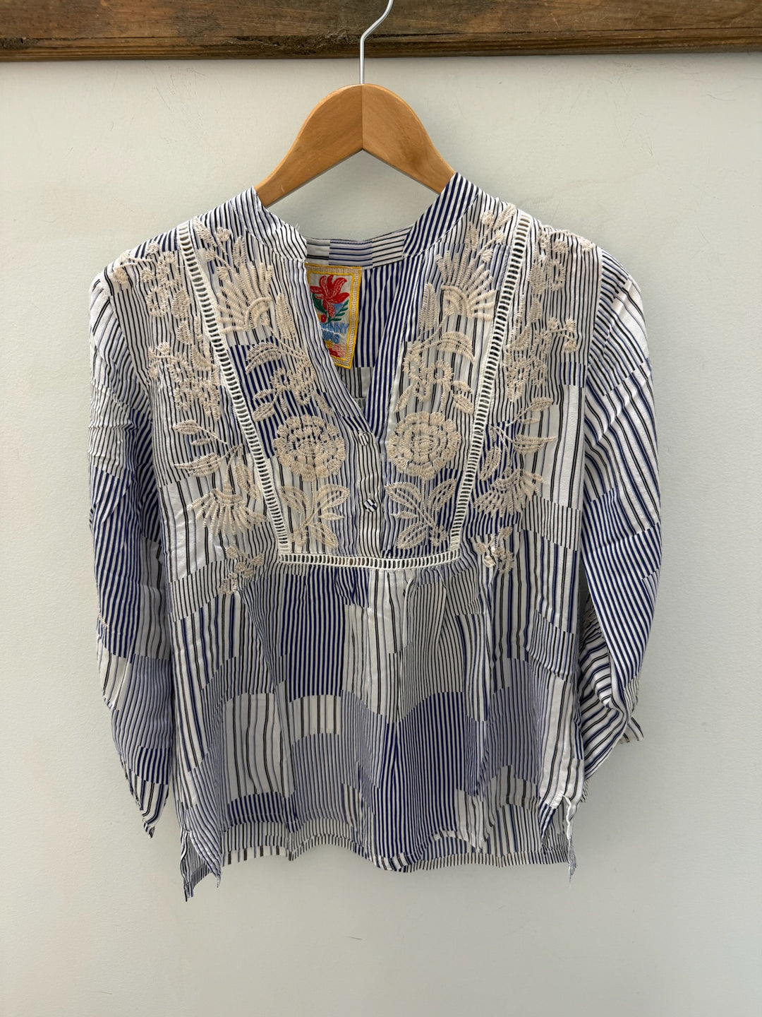 Johnny Was Lucinda Henley yoke blouse featuring intricate embroidery and lightweight fabric, displayed on a hanger.