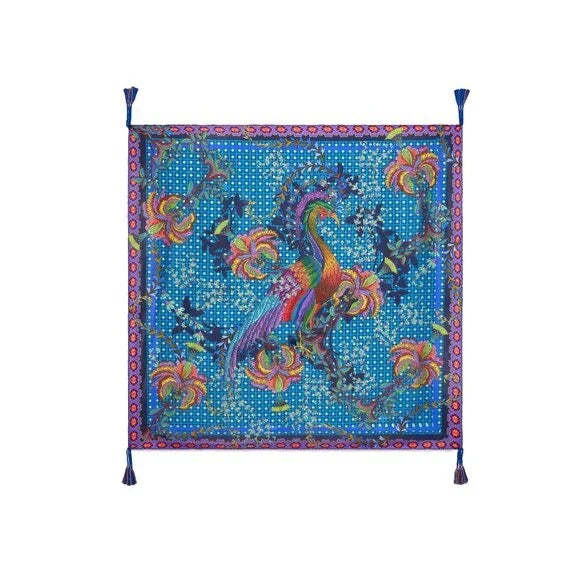 Colorful scarf with peacock design on a blue background