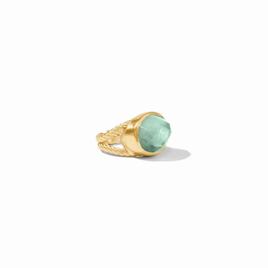 Julie Vos Nassau statement ring featuring a large aquamarine gemstone and intricate metalwork design.