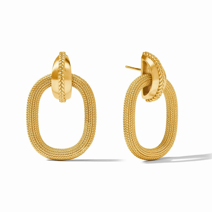 Julie Vos Cheval Doorknocker Earrings, elegant accessory with horse-themed gold-tone design, worn as stylish statement jewelry.