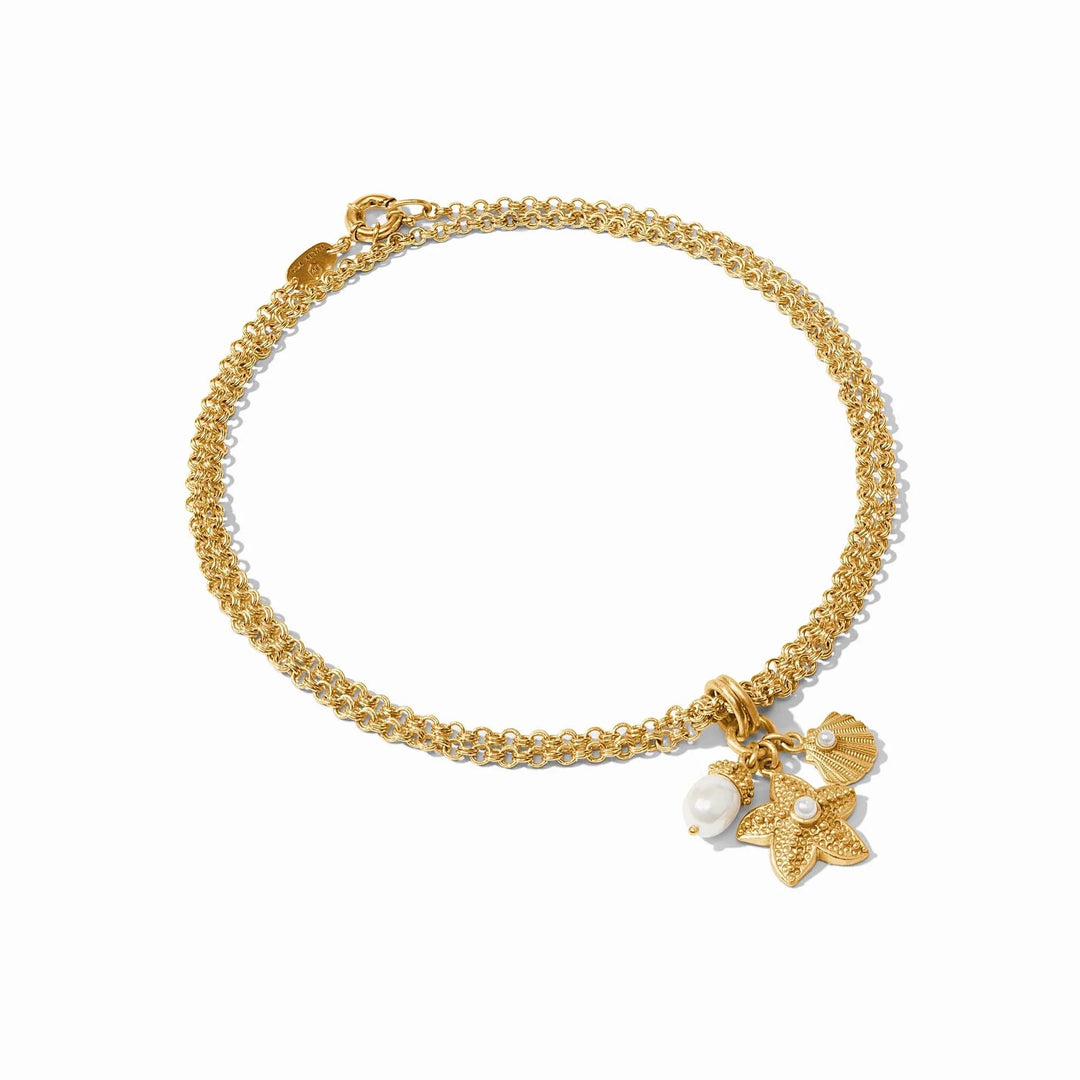 Julie Vos Sanibel Trio Charm Pendant featuring layered gold charms on a delicate chain for stylish accessories.