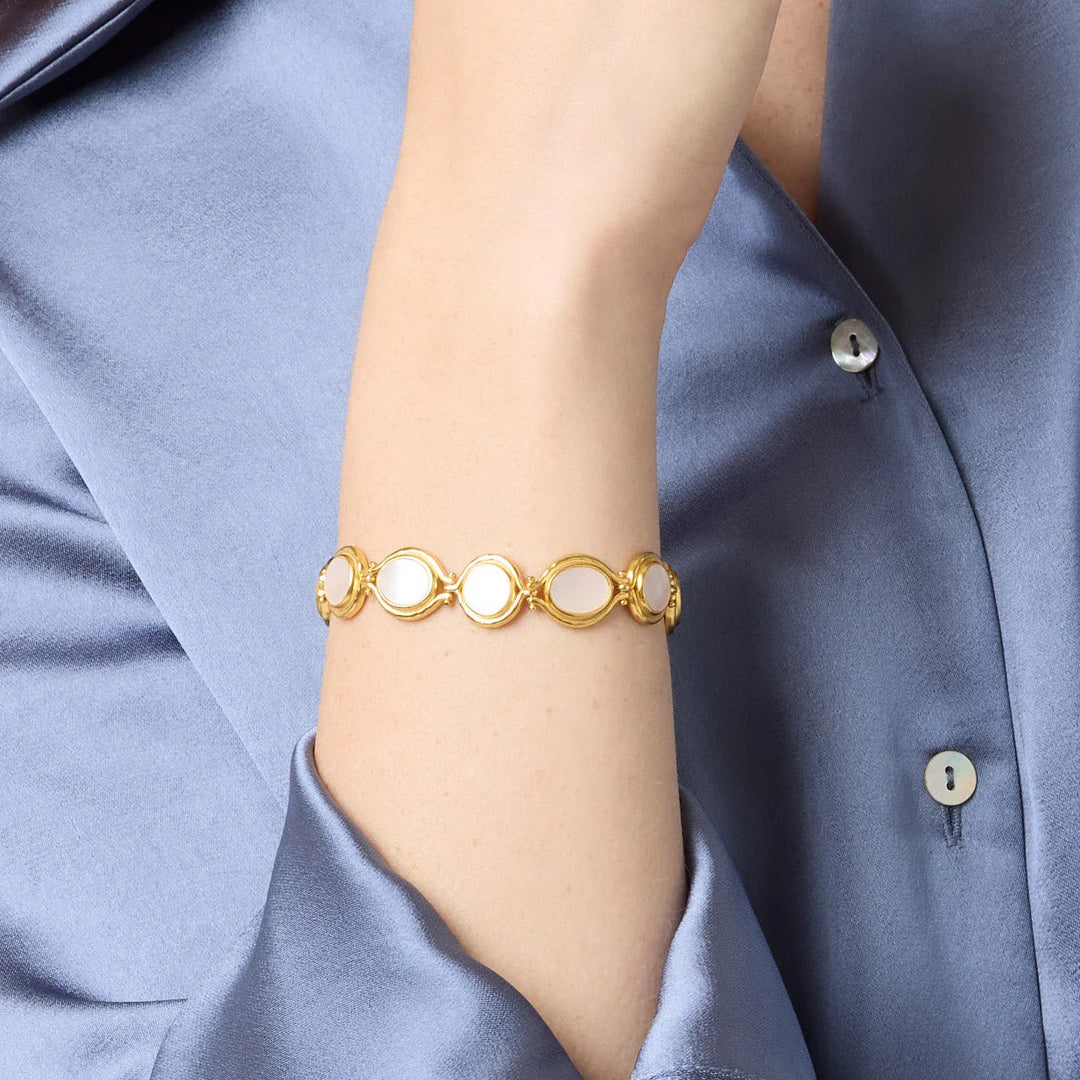 Julie Vos Saratoga Tennis Bracelet featuring sparkling gemstones and a delicate gold chain, elegant jewelry accessory.