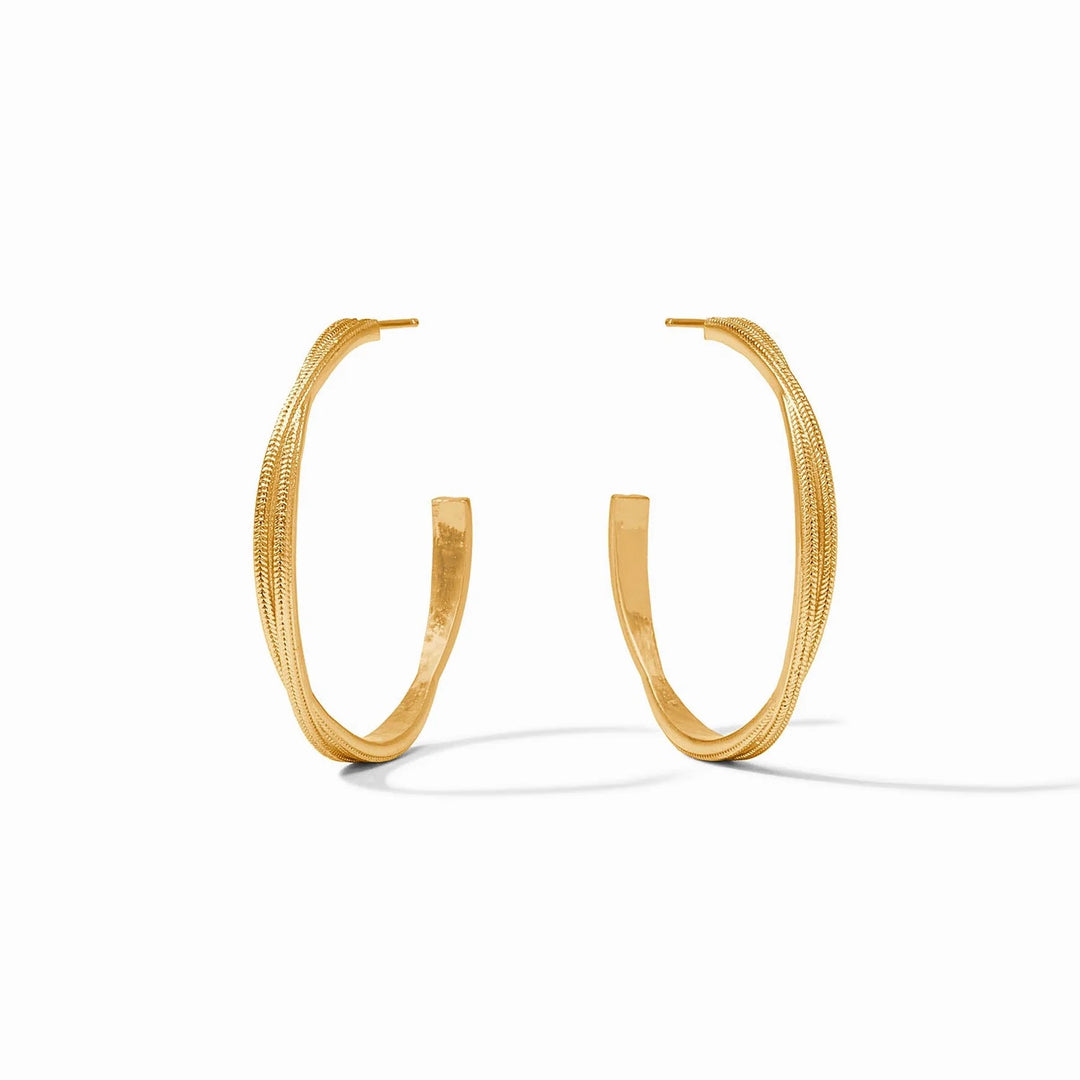 Julie Vos Cheval Twist Hoop earrings, gold-toned accessories with a twisted hoop design, displayed on a neutral background.