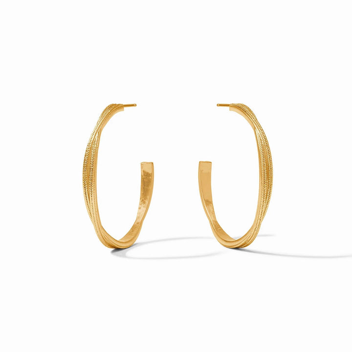 Julie Vos Cheval Twist Hoop earrings, gold-toned accessories with a twisted hoop design, displayed on a neutral background.