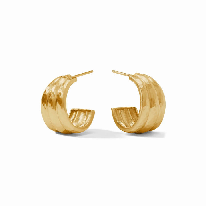 Julie Vos Cirque Hoops, gold-tone accessories with intricate circular design, shown on a model's ears.