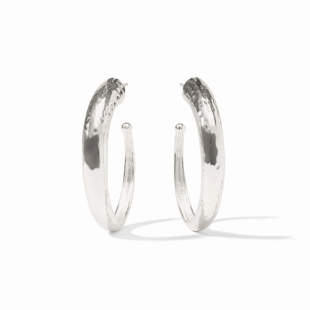 Silver hammered hoop earrings by Julie Vos, showcasing a textured, rounded design perfect for stylish accessories.