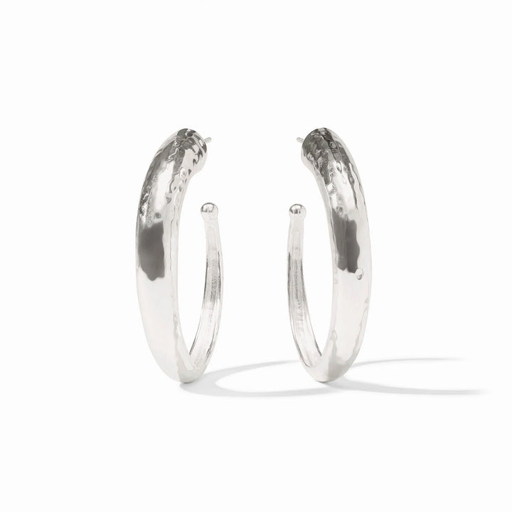 Silver hammered hoop earrings by Julie Vos, showcasing a textured, rounded design perfect for stylish accessories.