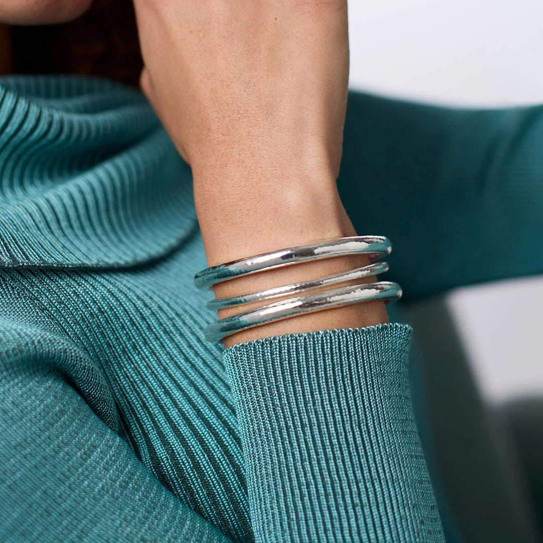 Silver Havana Demi Bangle bracelet by Julie Vos, featuring sleek, modern design with a polished finish, worn on a woman's wrist.