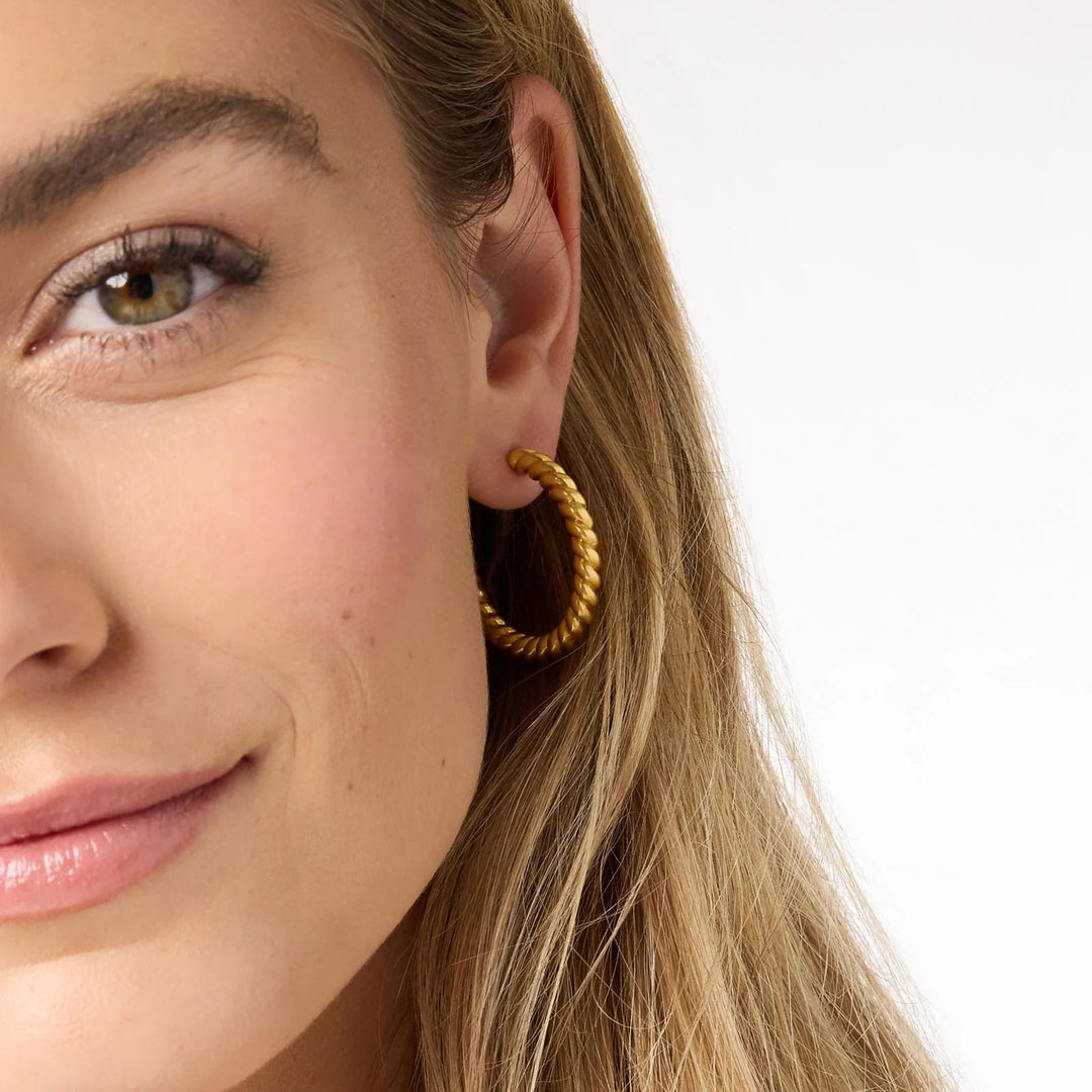 Julie Vos Nassau Hoop earrings, gold-toned accessories with a sleek hoop design, shown on a neutral background.