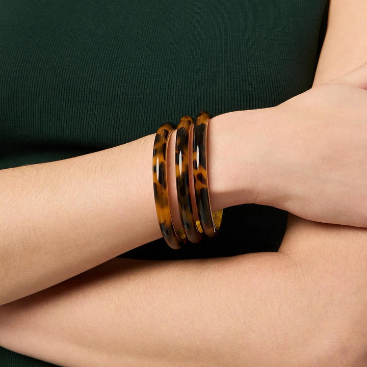 Julie Vos Madison Statement Bangle, elegant gold-toned accessories with intricate design, worn on a wrist.