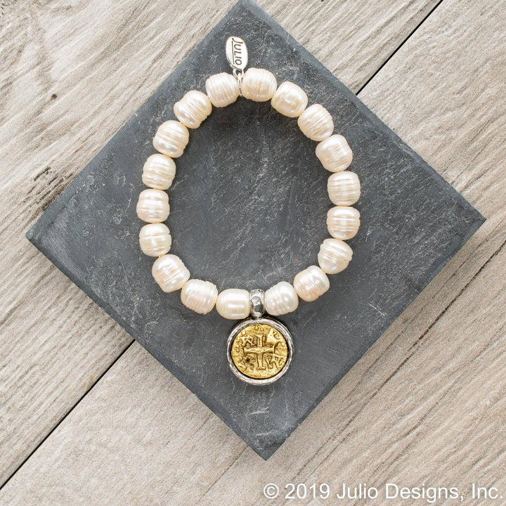 Silver fairy bracelet by Julio Designs featuring delicate fairy charm and intricate chain for magical accessory.