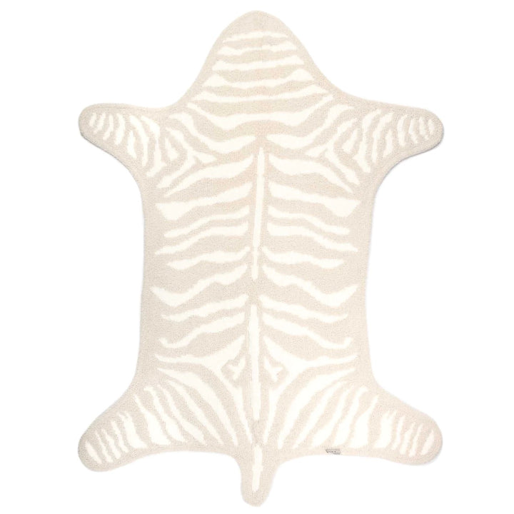 Kashwere zebra print playmat for the home featuring a soft, plush zebra stripe design suitable for children's play areas.