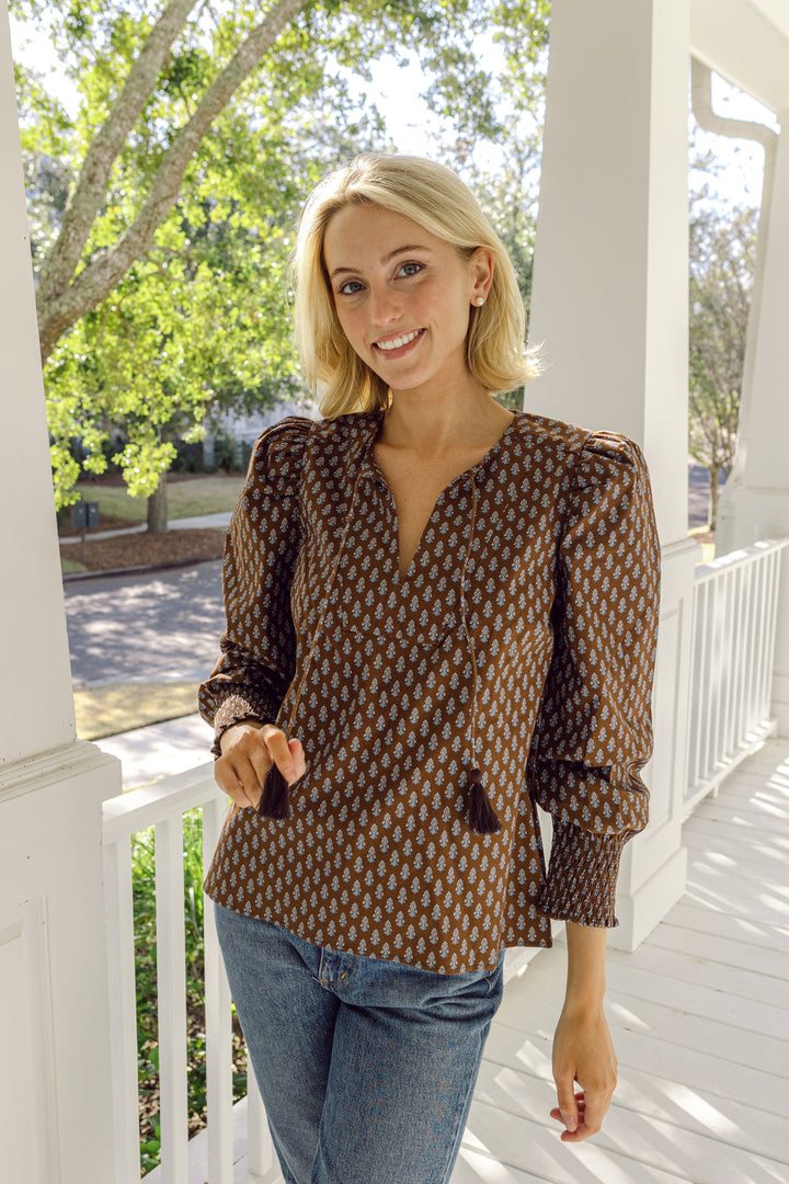 Block print tassel front top from Sail to Sable featuring a relaxed fit, with tassel details and vibrant print design.