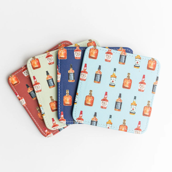 Set of four colorful Keva Style home coasters with vibrant patterns and protective cork backing for everyday use.