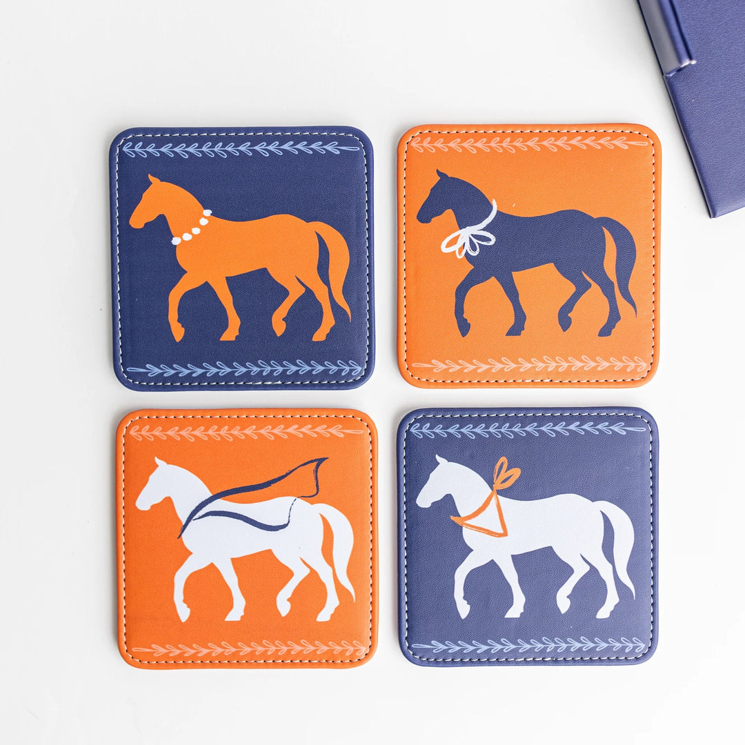 Set of four colorful Keva Style home coasters with vibrant patterns on a wooden surface.