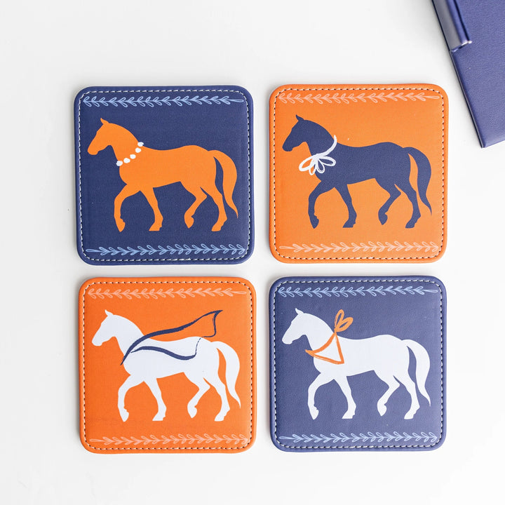 Set of four colorful Keva Style home coasters with vibrant patterns on a wooden surface.