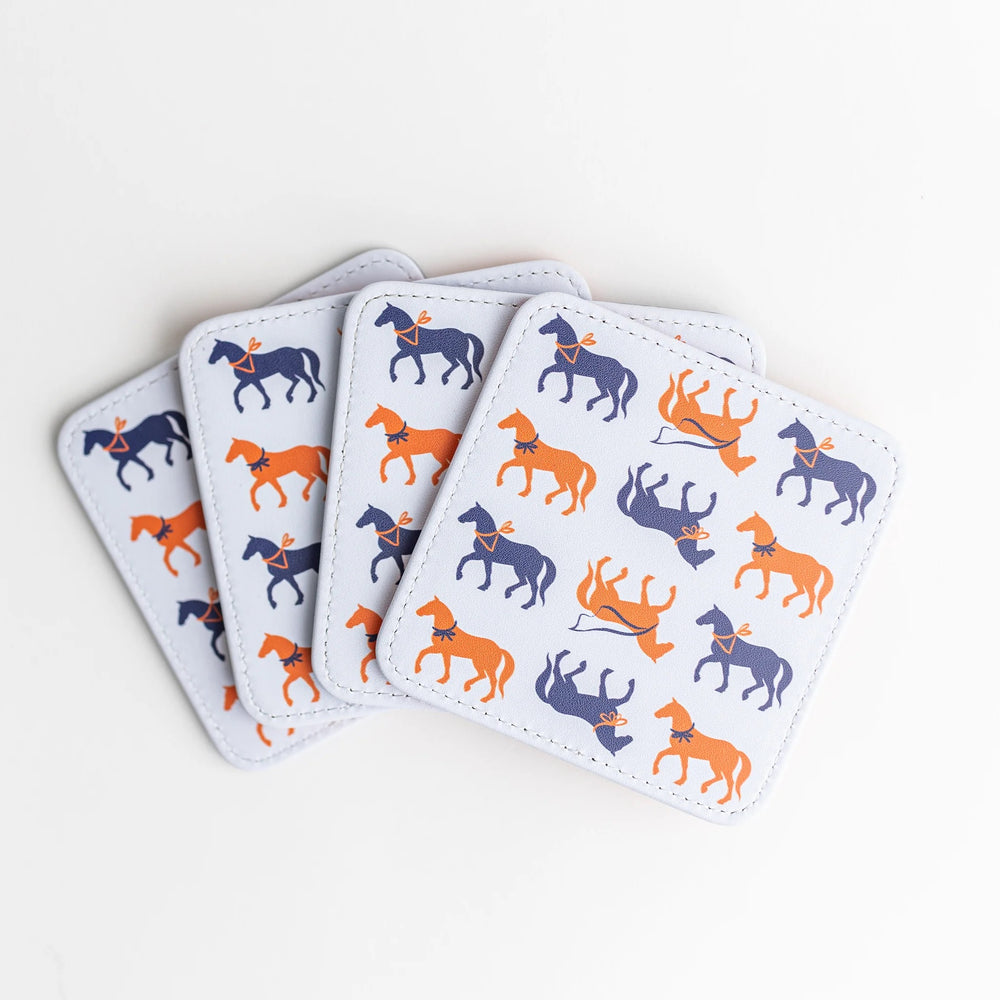 Set of four colorful Keva Style home coasters with vibrant patterns on a wooden surface.