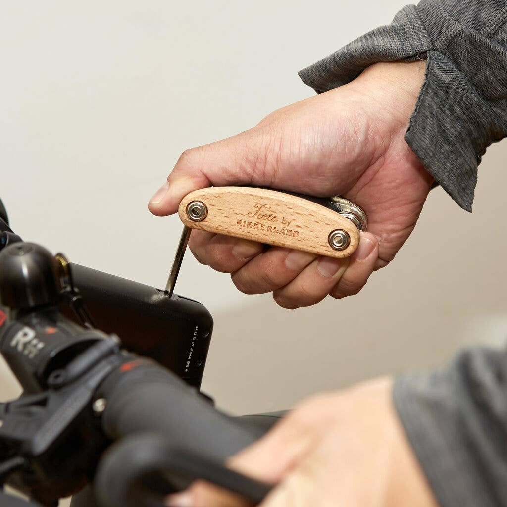 Kikkerland 16-in-1 bike tool with multiple screwdrivers, wrenches, and hex keys, compact and versatile for cycling repairs and maintenance.