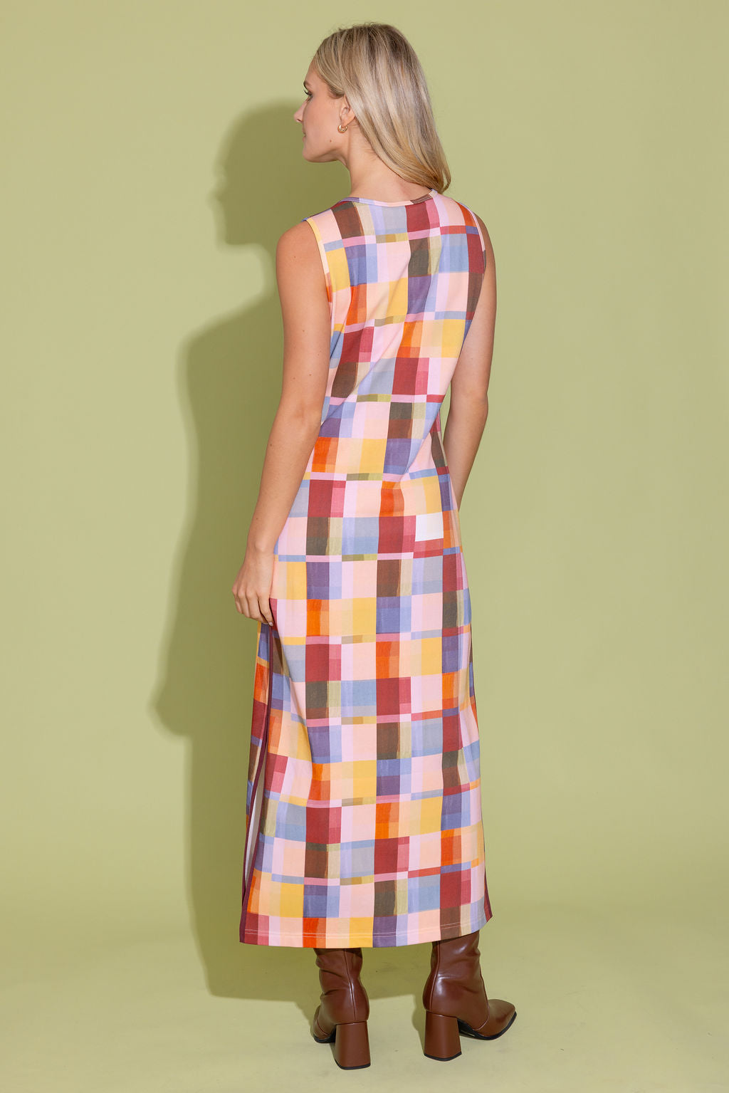 Alden Adair Berkley terracotta check dress displayed on a hanger, featuring a classic check pattern and stylish design.