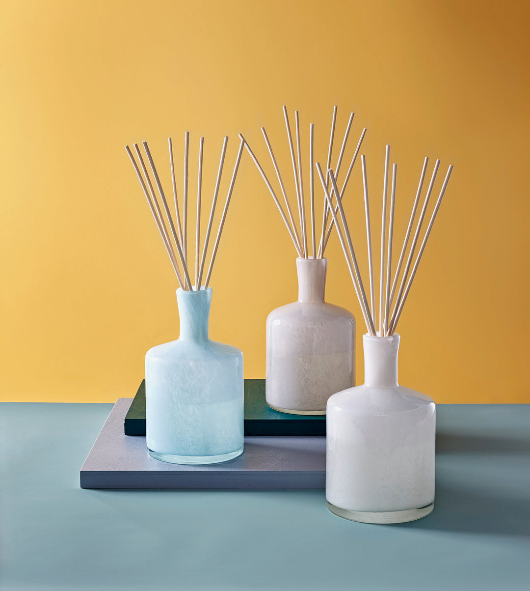 Lafco 6oz home diffuser with a sleek glass bottle and natural reed sticks, designed to add subtle fragrance to living spaces.