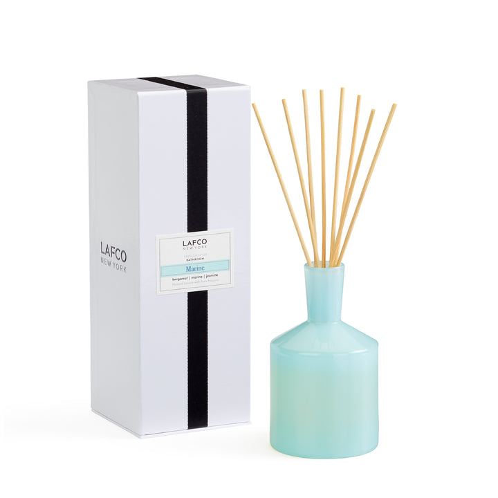 Lafco 6oz home diffuser with elegant glass bottle and reed sticks, designed to add a subtle fragrance to living spaces.