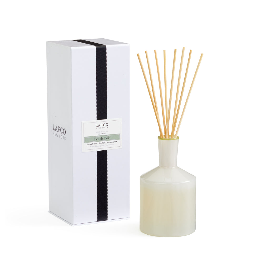 Lafco 6oz home diffuser with elegant glass container and reed sticks, designed to add a subtle fragrance to living spaces.