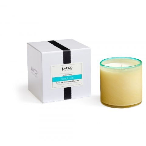 Lafco 15.5oz home candle with elegant glass holder and white wax, showcasing a luxurious ambiance.