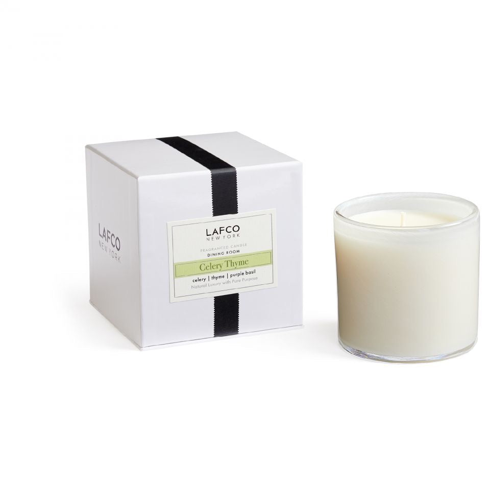 Lafco 15.5oz home candle with a glass container and elegant design, perfect for adding warmth and ambiance to any room.