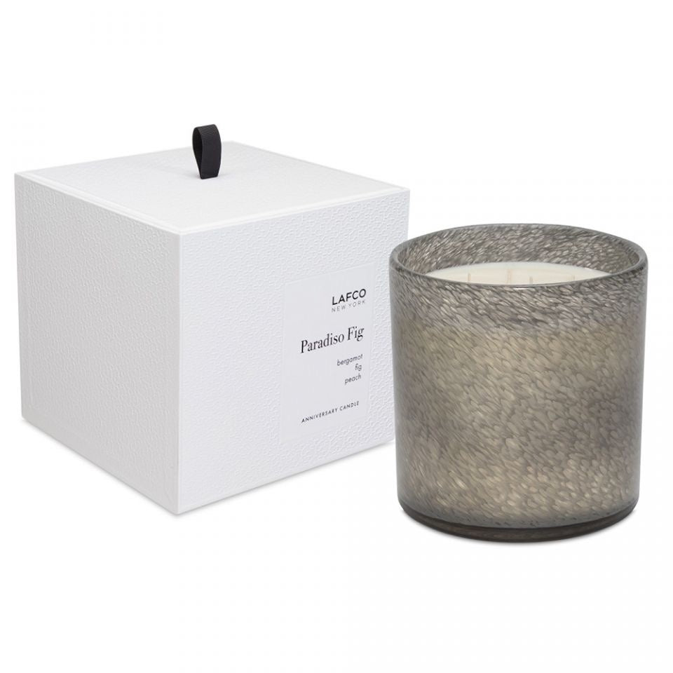 Lafco 15.5oz home candle with elegant glass container, showcasing a white wax candle for ambient home lighting.