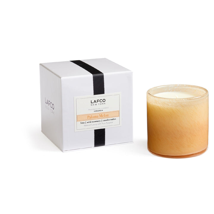 Lafco 15.5oz home candle featuring a sleek container with a lit wick, perfect for creating a warm, inviting atmosphere.