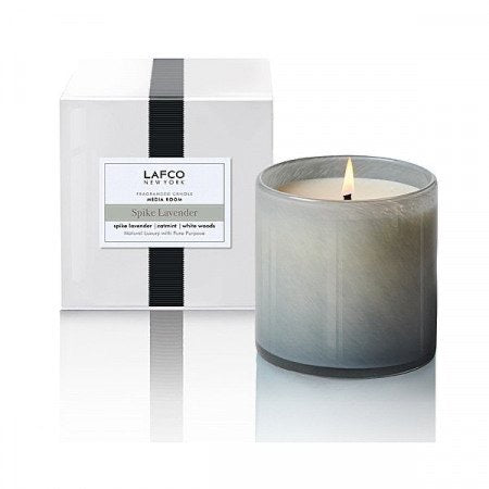 Lafco 15.5oz home candle with elegant glass holder and soft flickering flame, designed for stylish ambiance and fragrance.