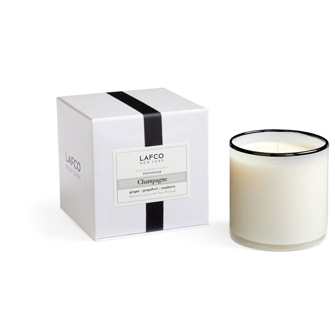 Lafco 15.5oz home candle with elegant glass holder and white wax, designed for creating a warm ambiance in living spaces.