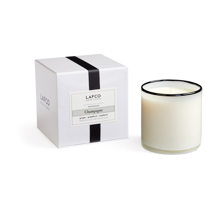 Lafco 15.5oz home candle with elegant glass holder and white wax, designed for creating a warm ambiance in living spaces.