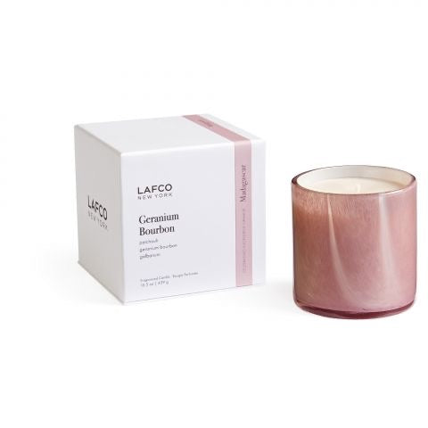 Lafco 15.5oz home candle with elegant glass container and white wax, perfect for creating a warm, inviting atmosphere.