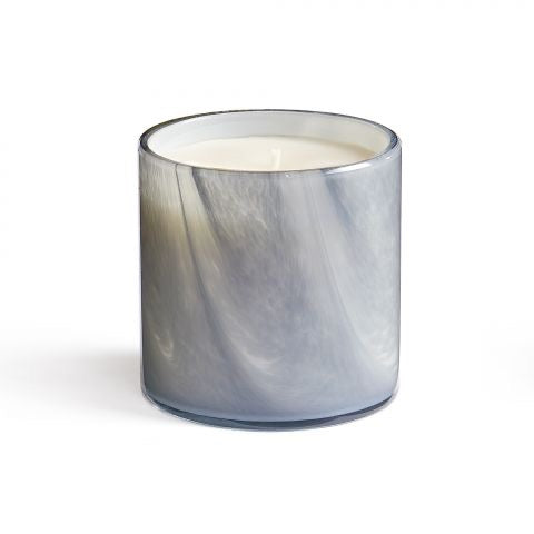 Lafco 15.5oz home candle with a white ceramic holder and a lit wick, showcasing its elegant design and warm glow.