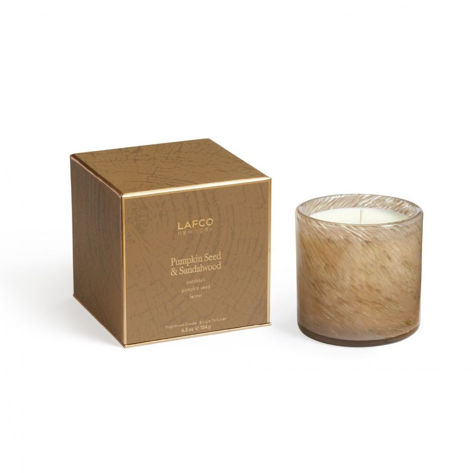 Lafco 15.5oz home candle with elegant glass jar and white wax, perfect for creating a warm, inviting atmosphere.