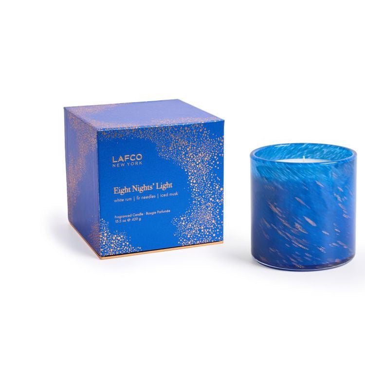 Lafco 15.5oz home candle with a sleek glass jar and white wax, designed to create a warm, inviting atmosphere.