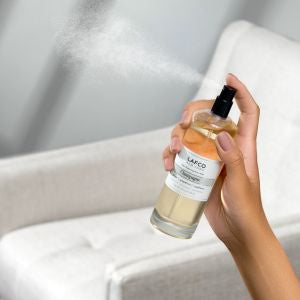 Lafco Odor Removing Room Mist in a 4oz bottle, freshening home air with natural, aromatic scent.