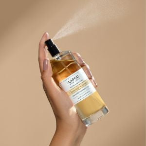 Lafco 4oz odor removing room mist in a clear glass bottle, designed to freshen indoor spaces with a subtle scent.