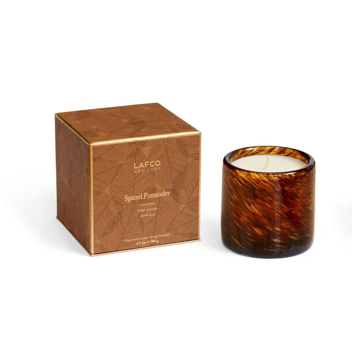 Lafco 6.5oz home candle with elegant glass container, showcasing a white wax candle ready to create a cozy ambiance.