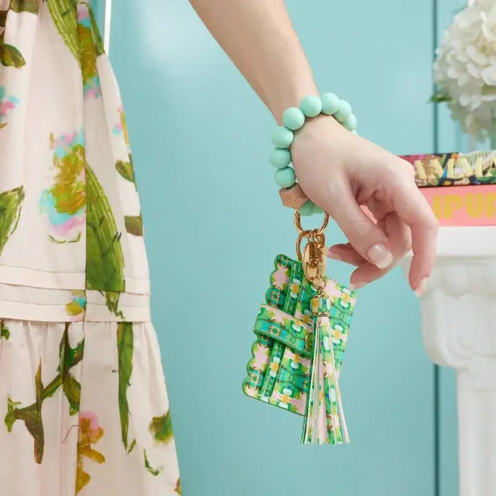 Laura Park Designs Boca Bay Wristlet Wallet showing a compact leather accessory with a wrist strap and stylish design.