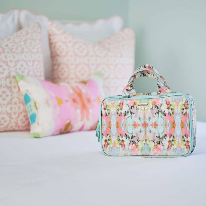 Laura Park Designs Brooks Avenue travel case, a stylish accessories pouch with a floral pattern and compact design for travel use.