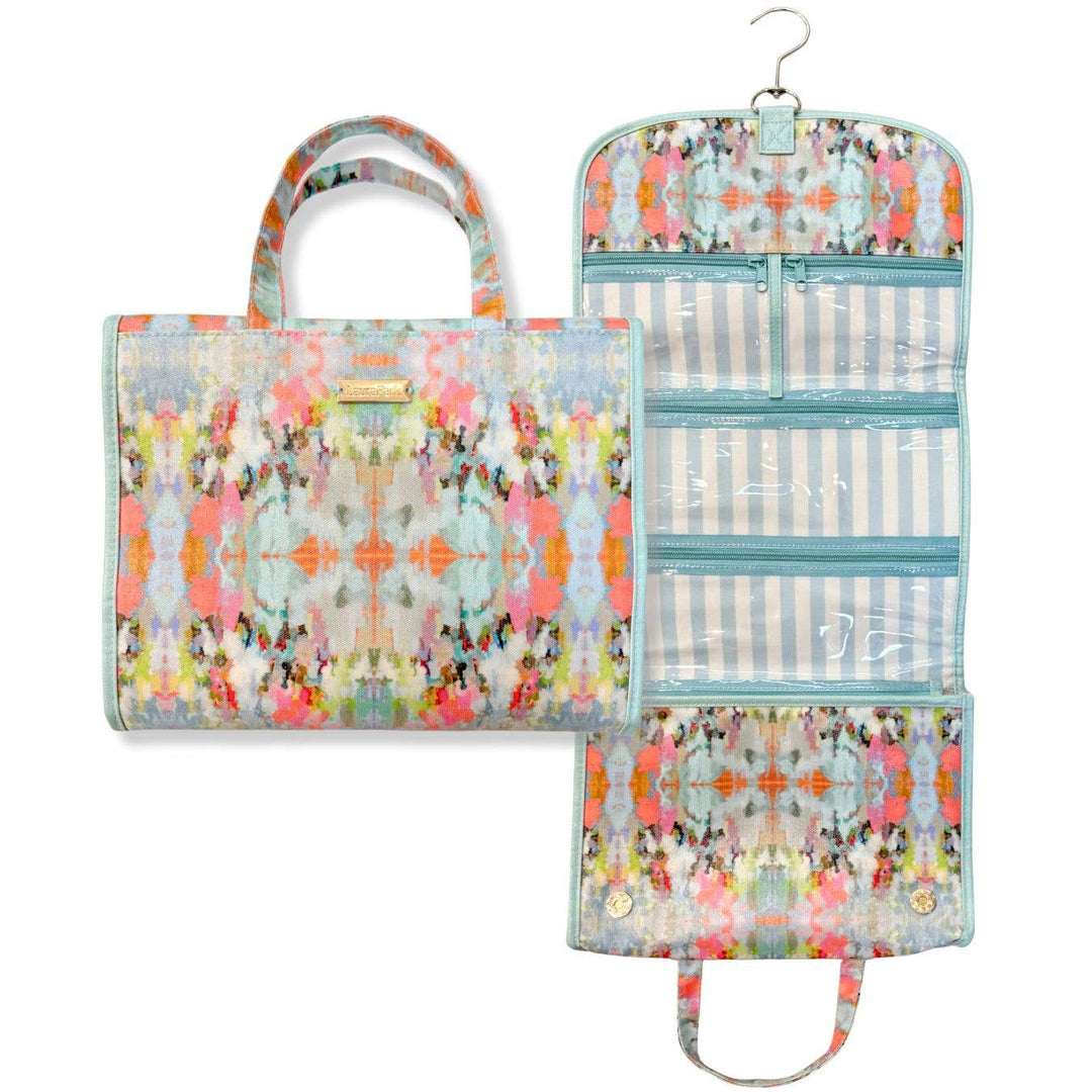 Laura Park Designs Brooks Ave Hanging Travel Case, a stylish gift with organized compartments for travel essentials, displayed hanging.