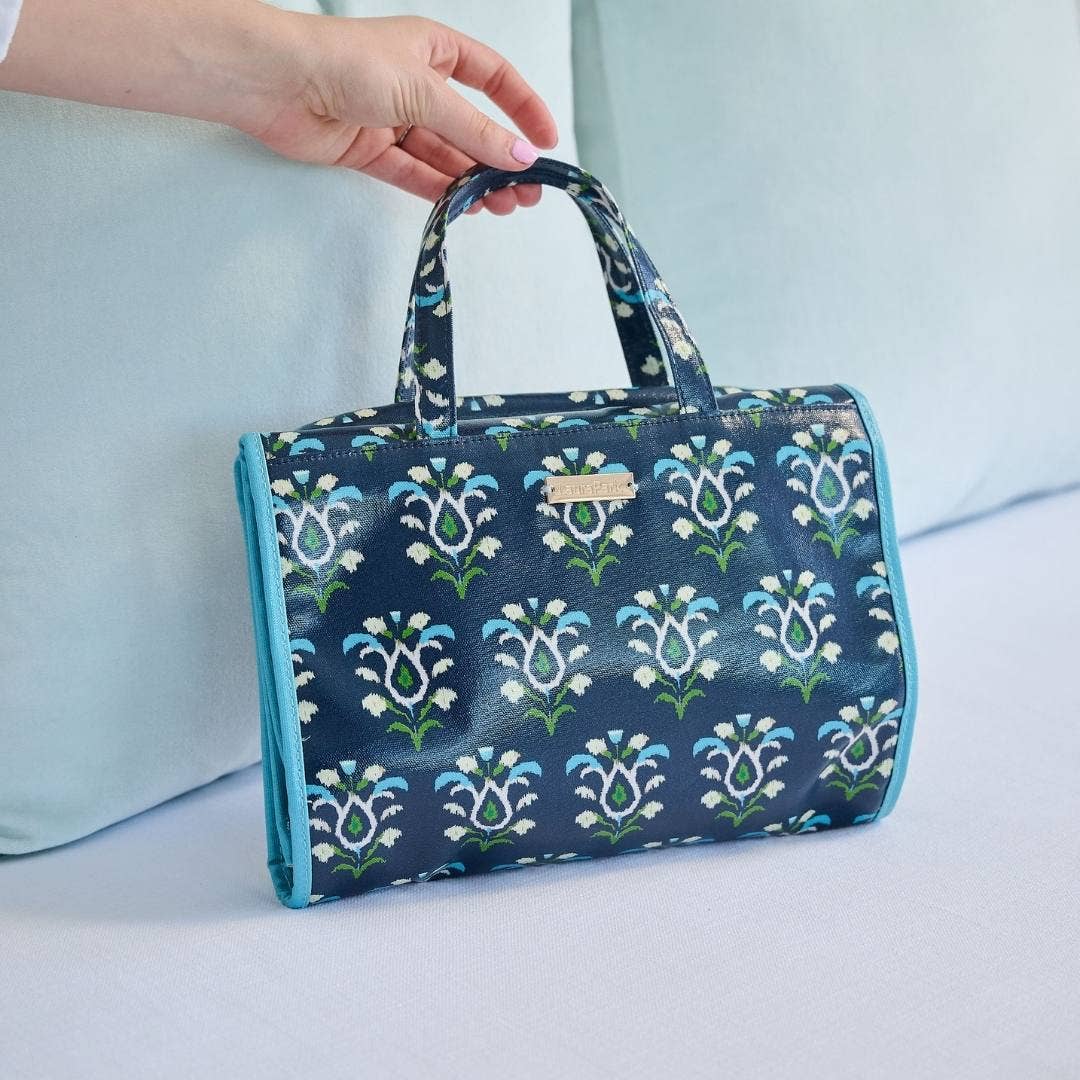 Rosemary Indigo hanging travel case by Laura Park Designs, compact gift organizer with a floral pattern and hanging loop.