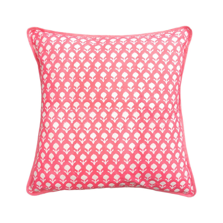 Pink block print pillow from Laura Park Designs showing the vibrant geometric pattern and soft textile surface.