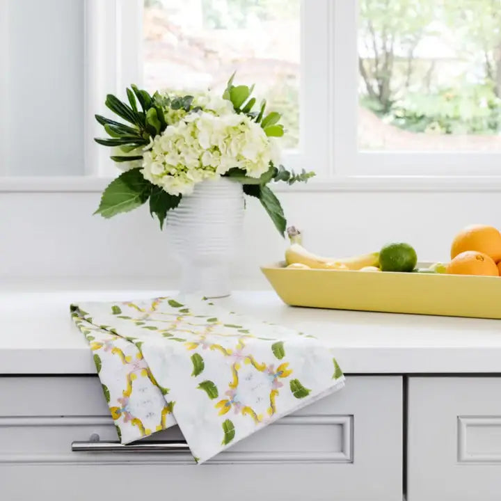 Laura Park Designs Dogwood Tea Towel, home décor with a floral dogwood design, shown hanging on a kitchen hook.